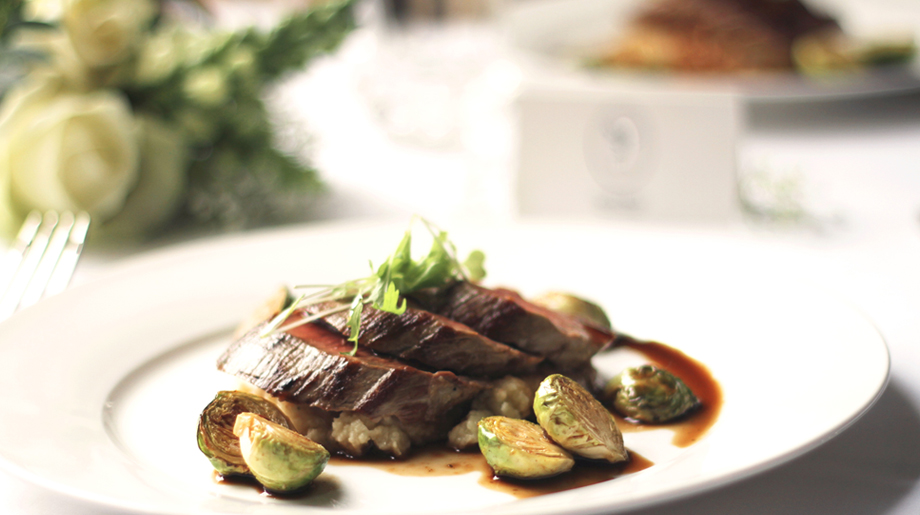Roast fillet of beef on pushed new potatoes, sautéed brussels sprouts with red wine sauce