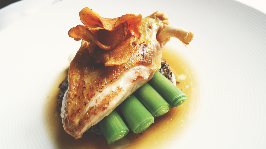 Roast guinea fowl with mushroom duxelle, leeks and parsnip crisp